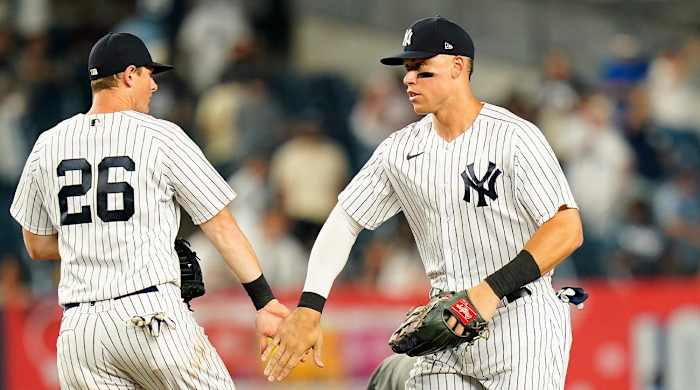 New York Yankees’ Aaron Judge, right, celebrates with teammate DJ LeMahieu after a baseball game against the Seattle Mariners, Monday, Aug. 1, 2022, in New York.